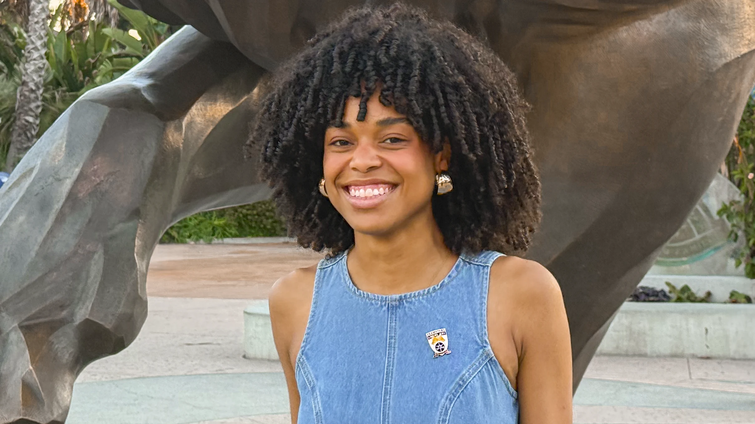 Savannah Luraya Soto smiles while standing outside the San Diego Zoo.